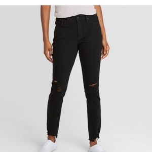 These are black jeans with little rips on both knees